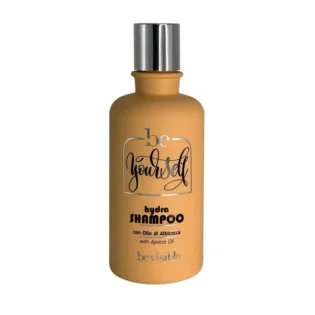 beYourself Hydra shampoo with apricot oil for hydration, presented in a sleek, amber bottle with a silver cap.