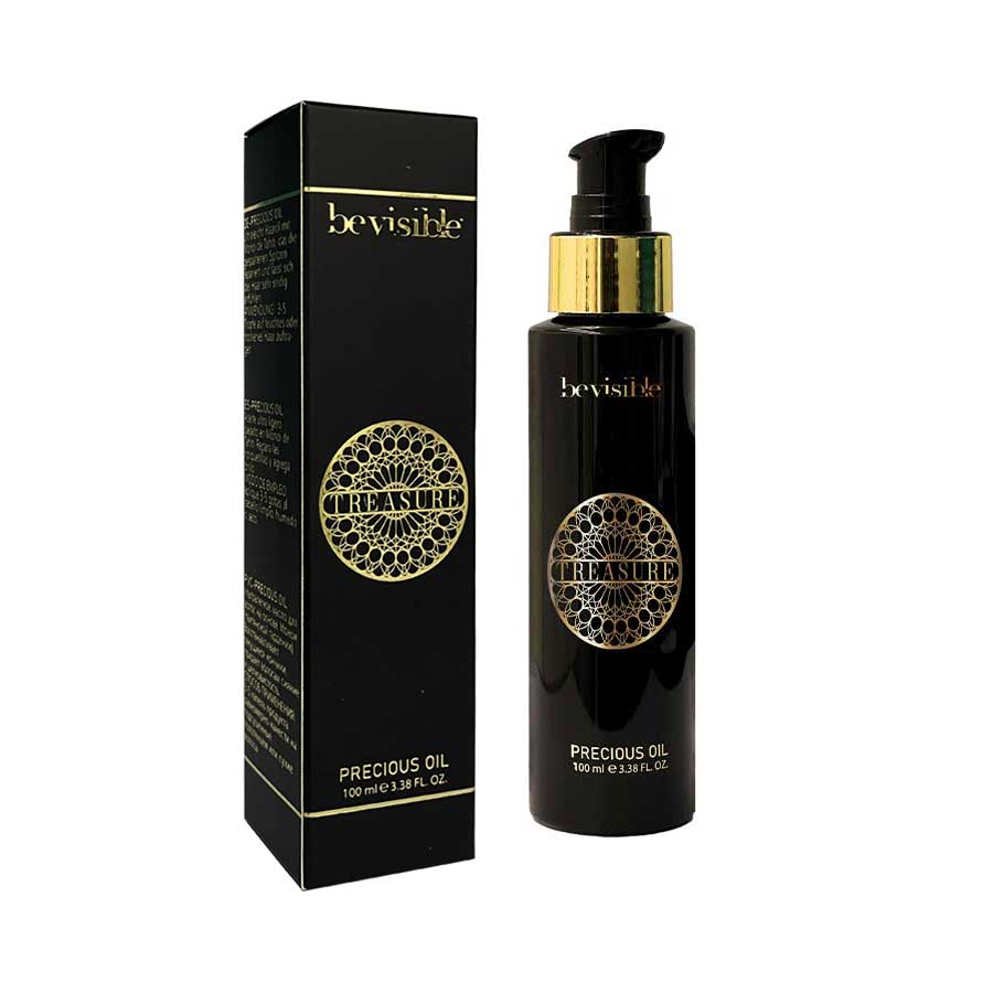 Precious oil treatment in a sleek black bottle, designed for hydration and shine, 100ml size for professional use.